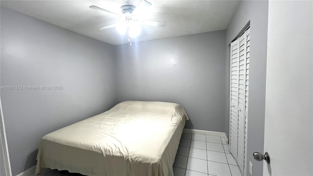 bedroom with light tile patterned floors and a ceiling fan