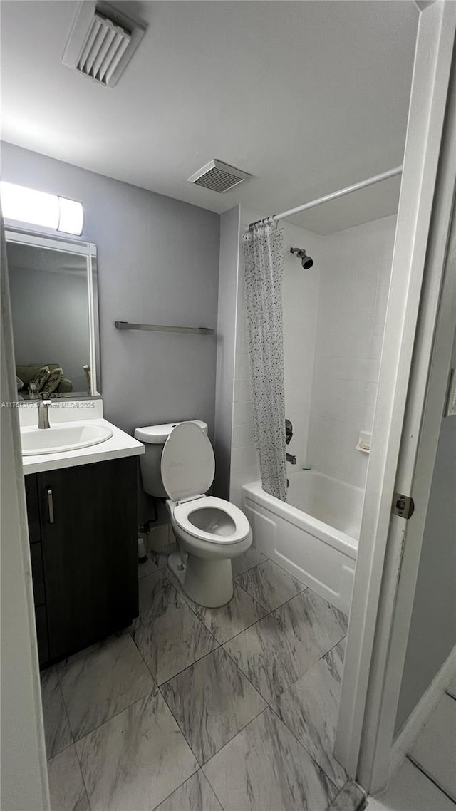 bathroom featuring shower / tub combo, toilet, visible vents, and marble finish floor