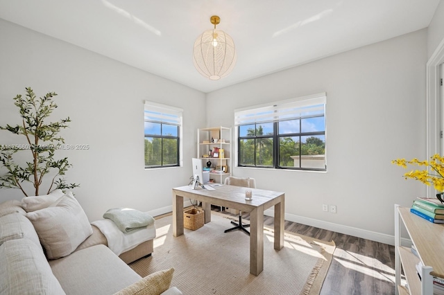 office space featuring wood finished floors and baseboards