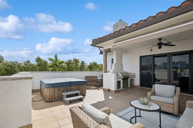 view of patio with a ceiling fan, an outdoor kitchen, an outdoor living space, a hot tub, and a grill