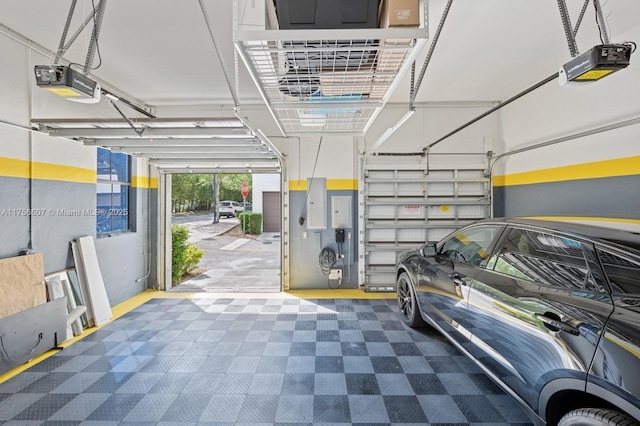 parking deck featuring a garage door opener