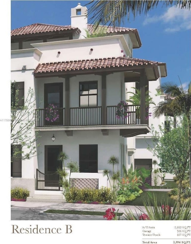 view of front of property with a tiled roof, a balcony, and stucco siding