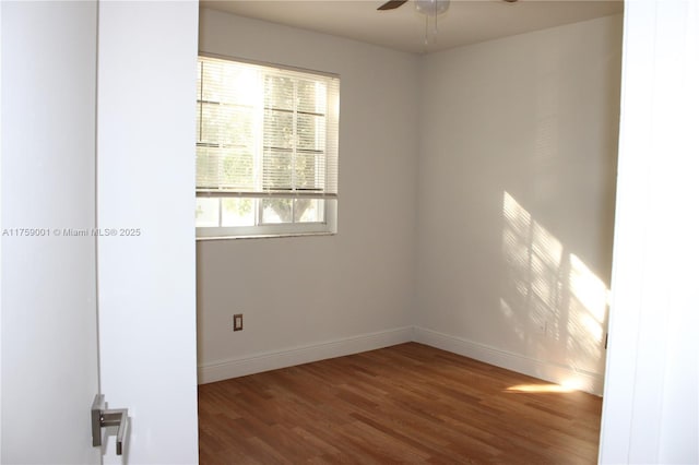 unfurnished room featuring baseboards, ceiling fan, and wood finished floors