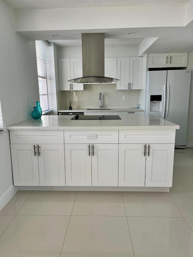 kitchen with backsplash, ventilation hood, fridge with ice dispenser, light tile patterned floors, and white cabinetry