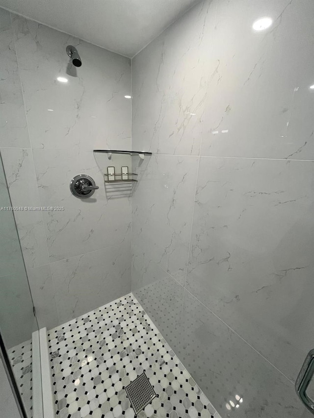 bathroom with a tile shower