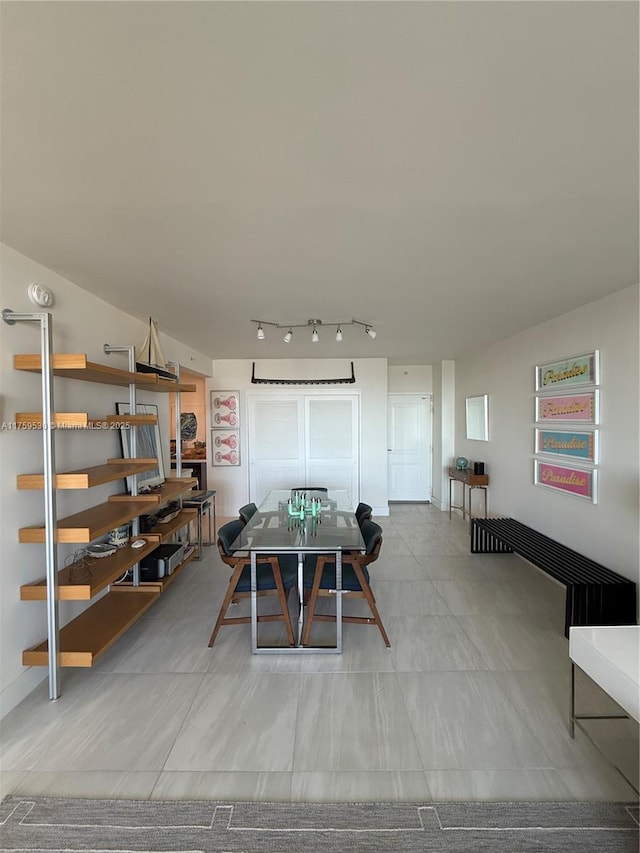 dining room featuring track lighting