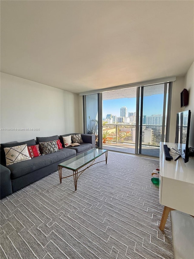 living area featuring a wall of windows