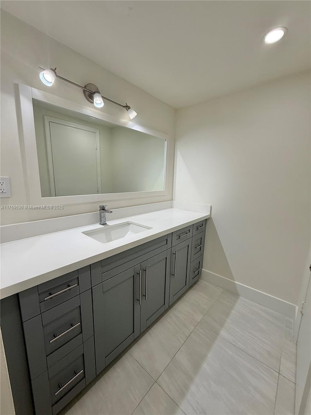 bathroom featuring vanity and baseboards