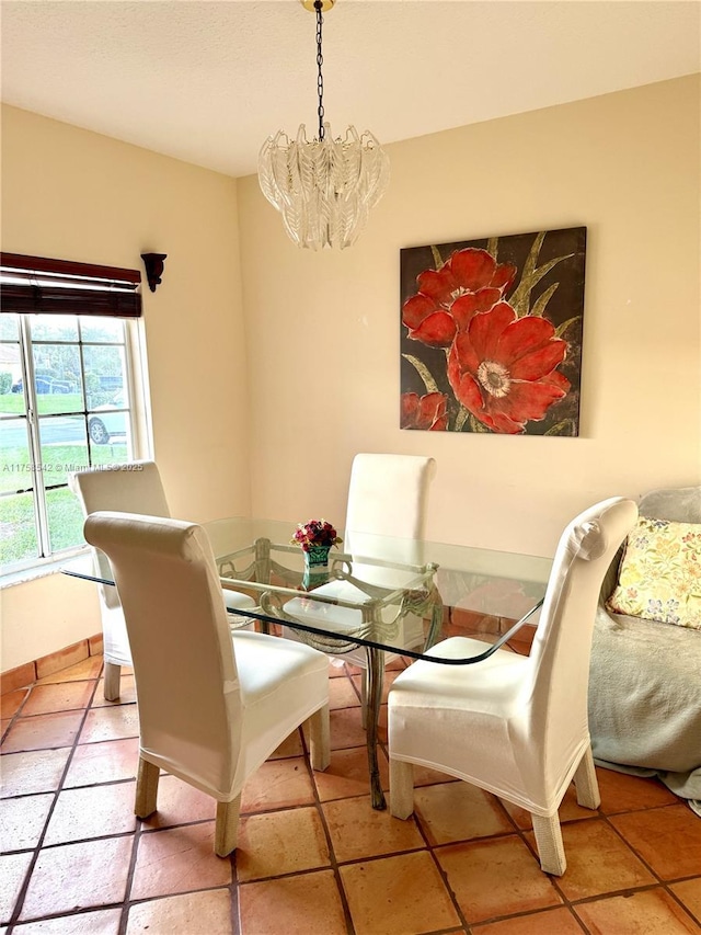 dining area featuring a notable chandelier