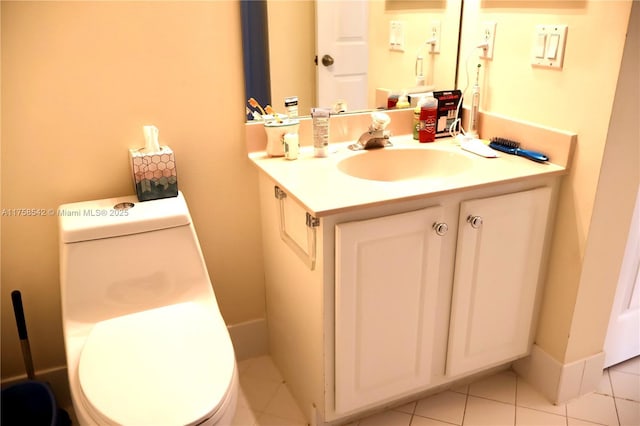 bathroom with vanity, toilet, and tile patterned flooring