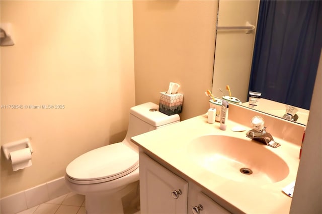 bathroom featuring tile patterned floors, toilet, and vanity