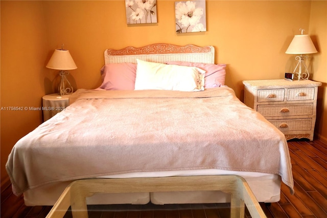 bedroom with wood finished floors