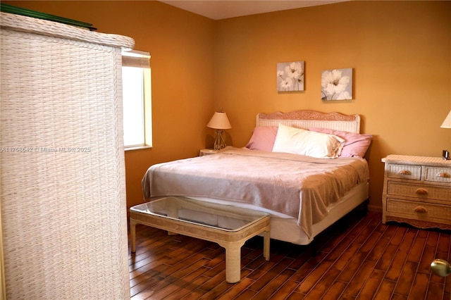 bedroom featuring dark wood-type flooring