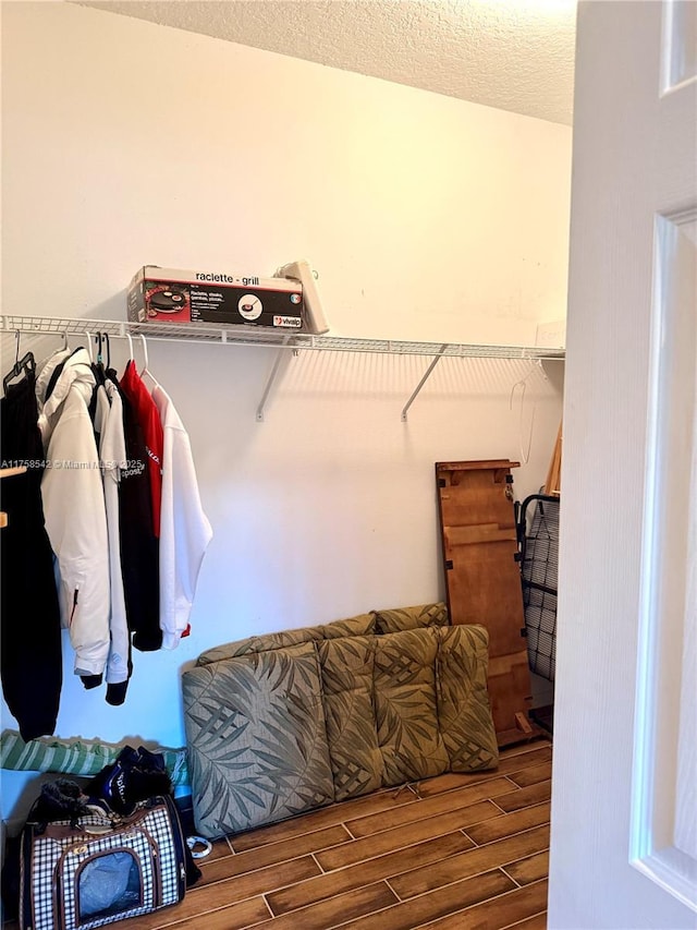 spacious closet with wood tiled floor