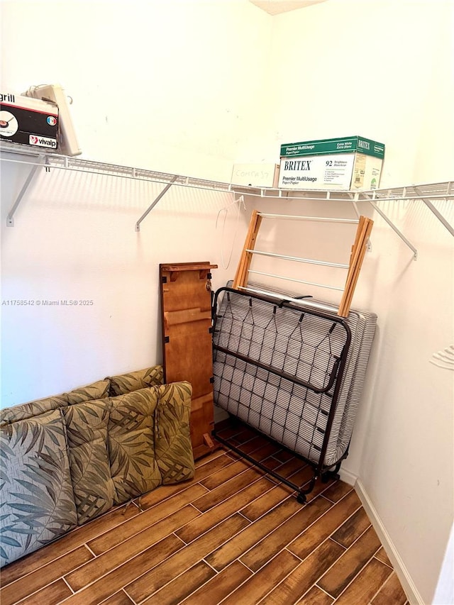 spacious closet with wood tiled floor