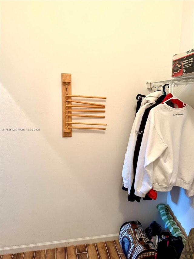 spacious closet with wood finished floors