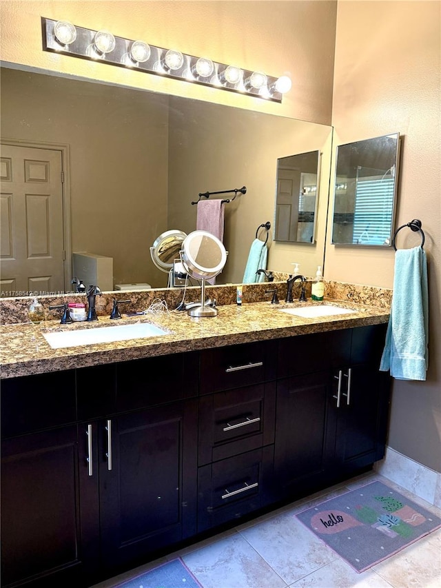 bathroom with double vanity and a sink