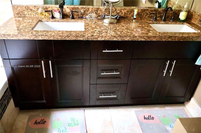 bathroom with double vanity and a sink