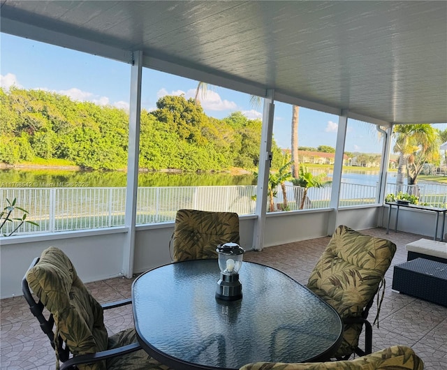 sunroom with a water view