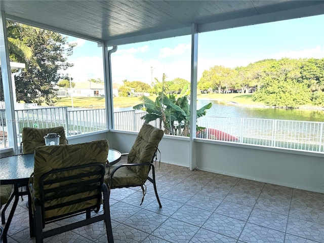 sunroom with a water view