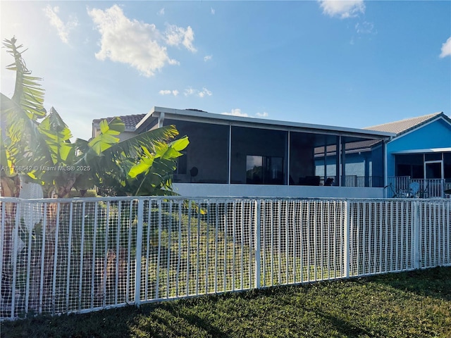 exterior space featuring a sunroom