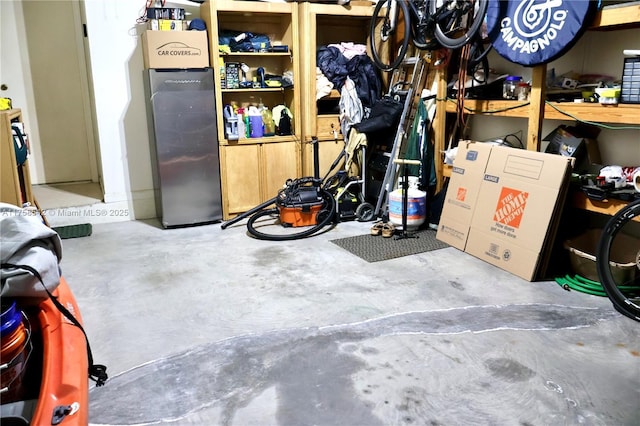 interior space featuring stainless steel refrigerator