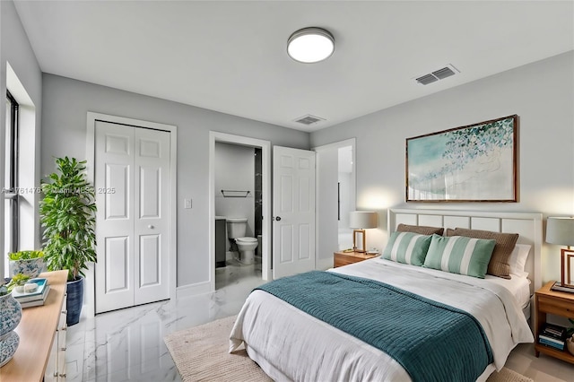 bedroom featuring visible vents, baseboards, marble finish floor, and connected bathroom