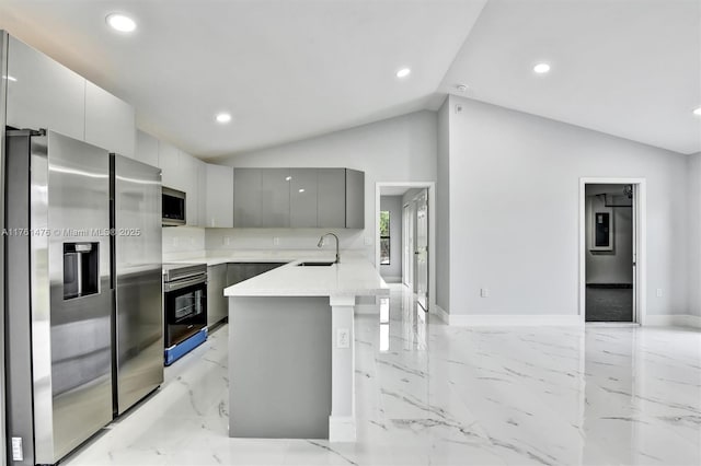 kitchen featuring a sink, stainless steel appliances, marble finish floor, and modern cabinets