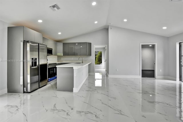 kitchen featuring visible vents, a sink, gray cabinetry, appliances with stainless steel finishes, and modern cabinets