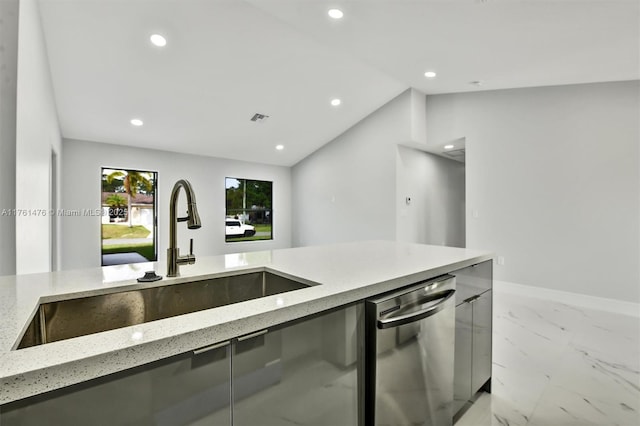 kitchen featuring light stone counters, visible vents, lofted ceiling, dishwasher, and marble finish floor