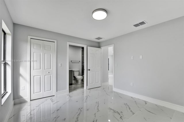 unfurnished bedroom featuring visible vents, marble finish floor, and baseboards