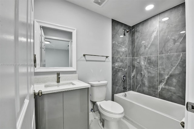 full bathroom featuring vanity, shower / tub combination, toilet, and visible vents