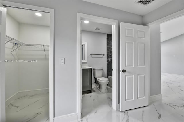 full bath featuring visible vents, baseboards, a spacious closet, toilet, and marble finish floor