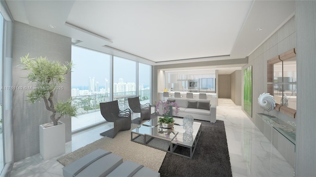 living area featuring a city view, floor to ceiling windows, a raised ceiling, and marble finish floor