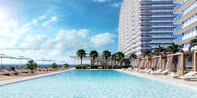 community pool with fence and a patio area