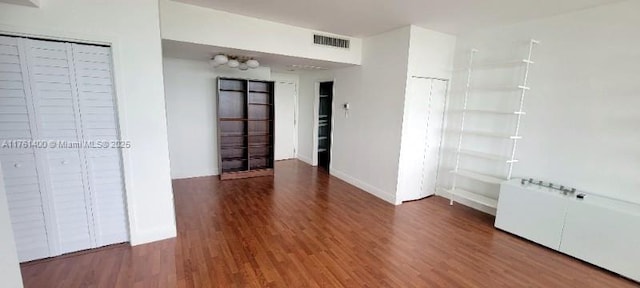 700 Biltmore Way Unit 1005, Coral Gables, FL 33134 - unfurnished bedroom featuring wood finished floors and baseboards