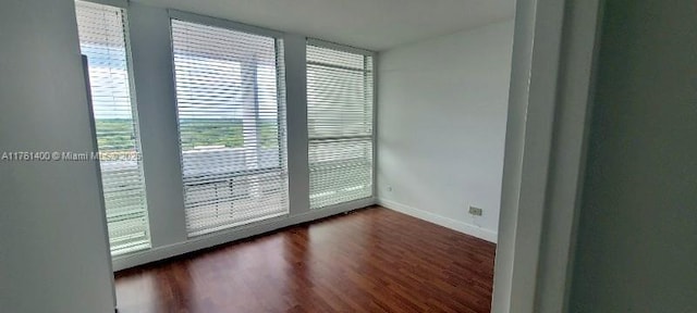 700 Biltmore Way Unit 1005, Coral Gables, FL 33134 - empty room featuring dark wood-type flooring and baseboards