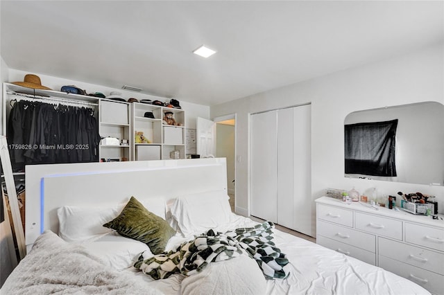 bedroom featuring a closet and visible vents