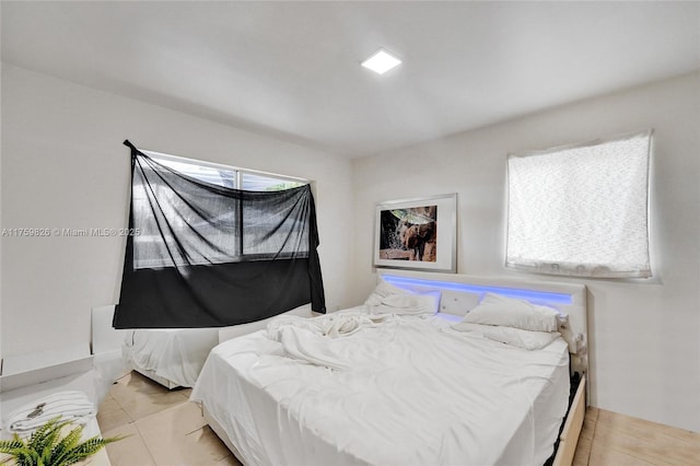 bedroom with light tile patterned flooring