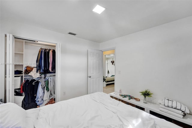 bedroom featuring a closet and visible vents