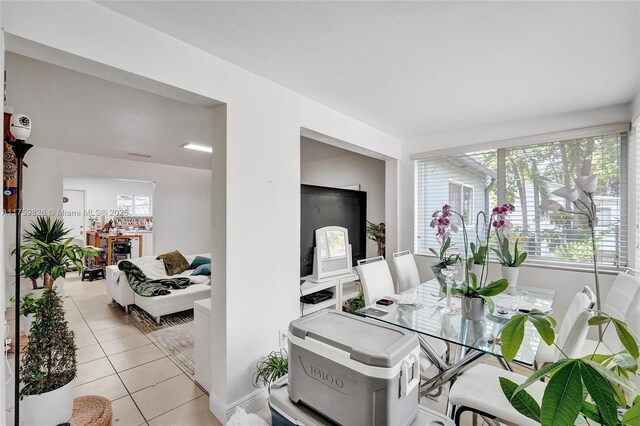 interior space featuring light tile patterned floors and plenty of natural light