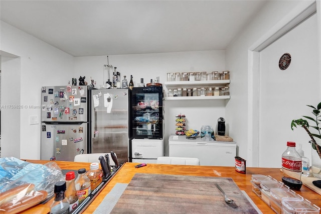 kitchen featuring fridge and freestanding refrigerator