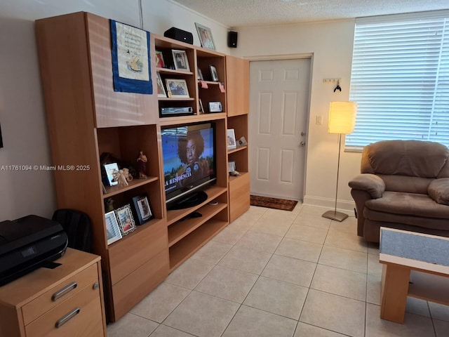 living room with light tile patterned flooring and a textured ceiling