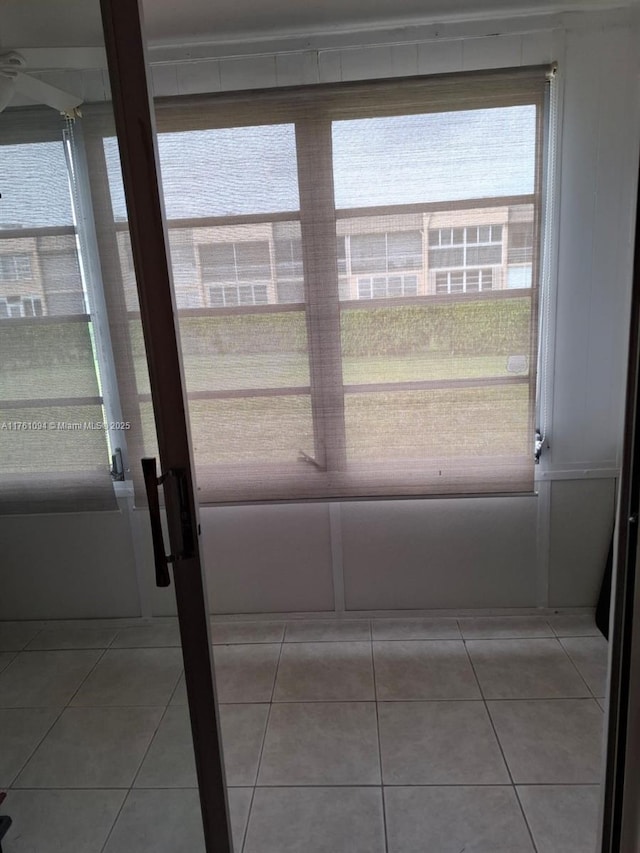 entryway with light tile patterned floors