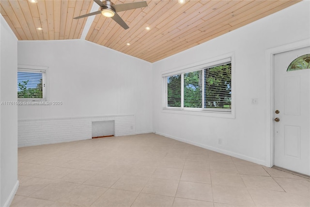 unfurnished room featuring plenty of natural light, wooden ceiling, a ceiling fan, and lofted ceiling