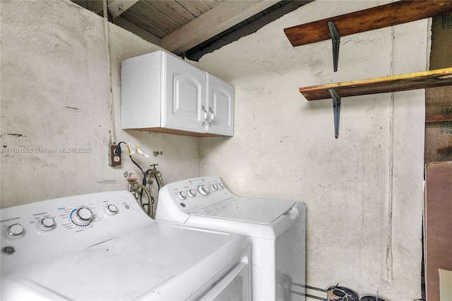 laundry area featuring cabinet space and washer and clothes dryer