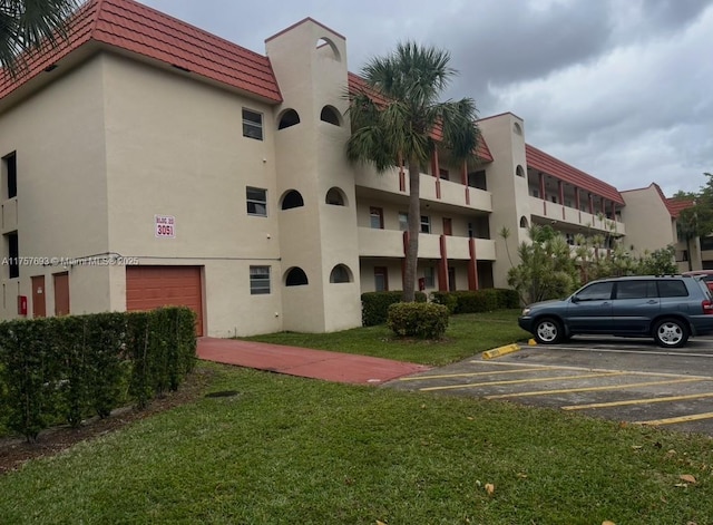 view of property with uncovered parking