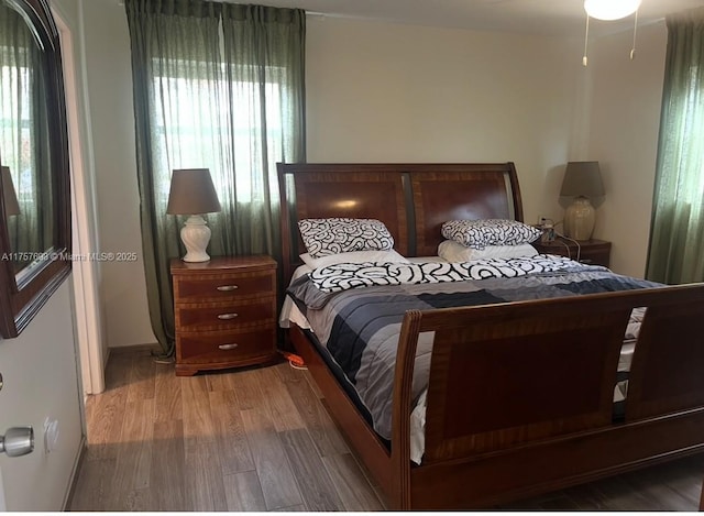 bedroom with baseboards and light wood-style flooring