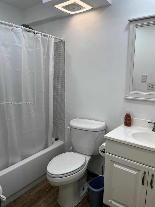 bathroom with shower / bathtub combination with curtain, wood finished floors, visible vents, toilet, and vanity