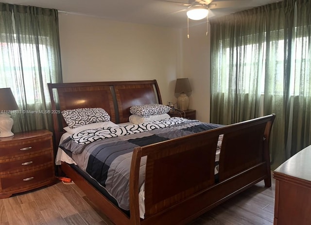 bedroom with light wood finished floors and ceiling fan